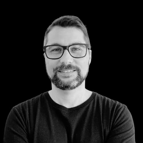 Avatar of a guy with a beard, glasses and smiling